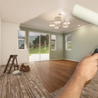 A partially painted modern living room showing a before-and-after contrast, highlighting the impact of fresh paint for home staging in Oak Ridges & GTA real estate.