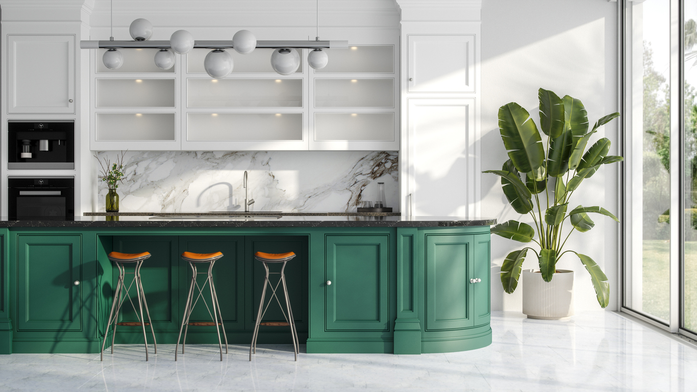 Elegant green kitchen with a large island, marble backsplash, and modern lighting, highlighting the appeal of stylish kitchen upgrades in homes across Oak Ridges and the GTA.