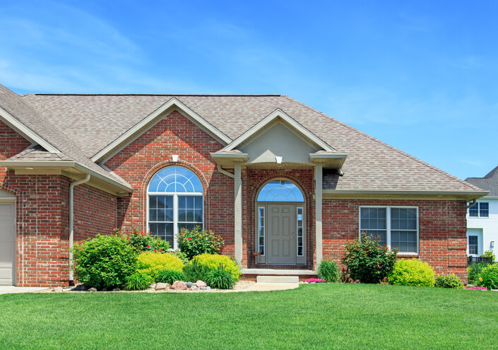 A beautifully maintained brick home with fresh landscaping, showcasing curb appeal improvements to help sell your home faster in Oak Ridges & the GTA.